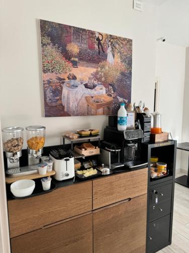 a kitchen with a counter with food on it at Ro&Ro Napoli luxury rooms in Naples