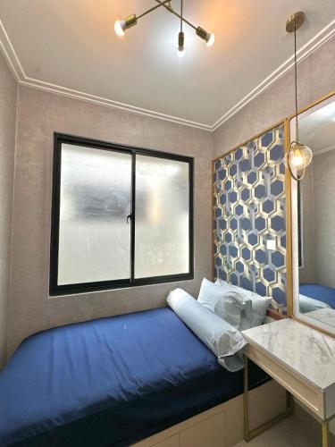Ένα ή περισσότερα κρεβάτια σε δωμάτιο στο CJ House PIK 2