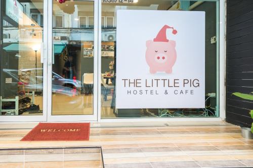 a sign in the window of a store at The Little Pig Sukhumvit in Bangkok