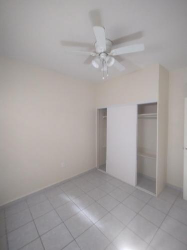 an empty living room with a ceiling fan at Horóscopo in Rancho Mesa de Tijuana