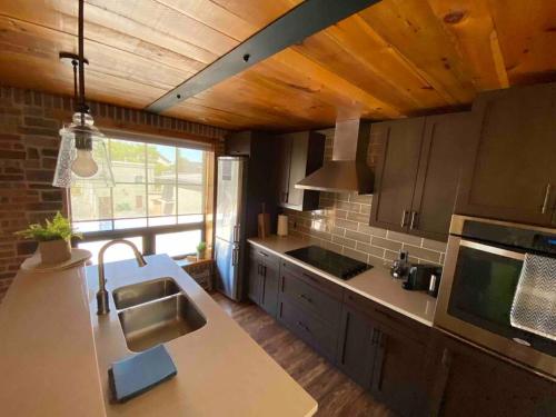 a kitchen with a sink and a counter top at Cozy downtown studio getaway in Kingston