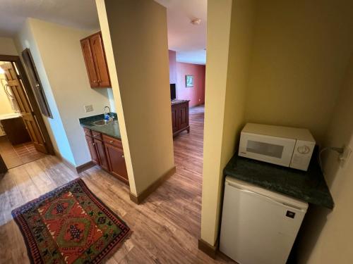 a kitchen with a microwave on top of a counter at Artists Colony in Nashville