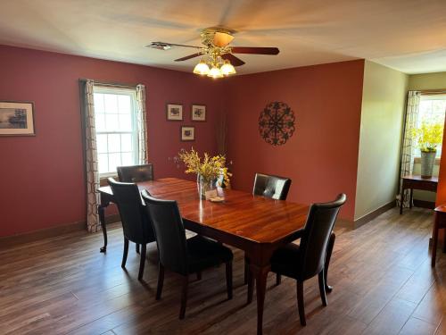 a dining room with a wooden table and chairs at Artists Colony in Nashville