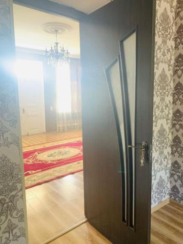 an open door in a room with a room with a floor at Uplistsikhe guest "Paluma" in Kʼvakhvreli