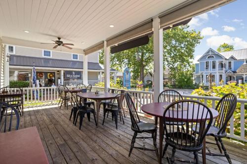 a patio with tables and chairs on a deck at Artists Colony in Nashville