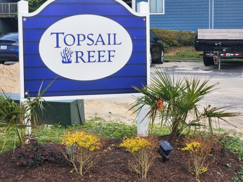 a sign for atocall reaper in a parking lot at Beachfront Bungalow 125 in North Topsail Beach