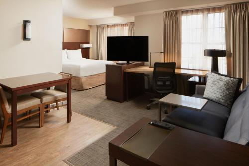 a hotel room with a bed and a living room at Residence Inn Arlington Rosslyn in Arlington