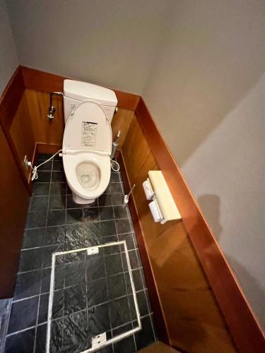 a bathroom with a toilet in a small room at 貸切御宿 和 Nagomi in Utsunomiya
