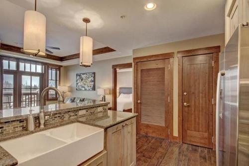a kitchen with a sink and a counter top at Luxury 1 Bedroom Ski In, Ski Out One Ski Hill Residence Located At The Base Of Peak 8 With Bowling Alley Onsite in Breckenridge