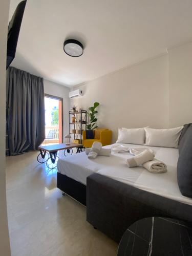 a bedroom with a large bed in a room at Blue Cozy Nest in Rhodes Town