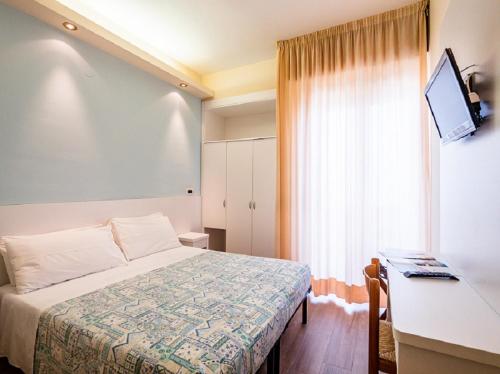 Postel nebo postele na pokoji v ubytování Hotel Sirena