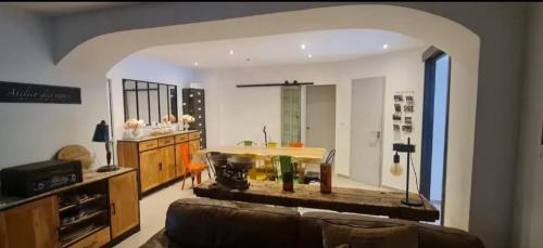 a living room with a couch and a table at Cocon entre mer et vigne in Saint-Cyr-sur-Mer