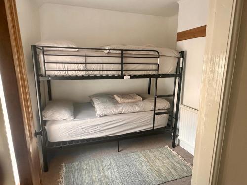 a couple of bunk beds in a room at House in Llanberis in Llanberis