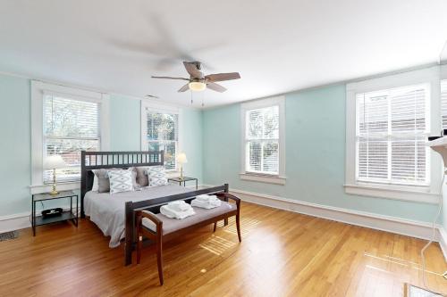 a bedroom with a bed and a ceiling fan at Historic Charmer in Wilmington