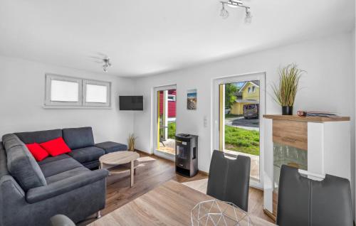 a living room with a couch and a table at Seehund Xl in Süssau