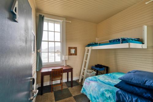 a bedroom with a bunk bed and a desk at HI Point Montara Lighthouse in Montara