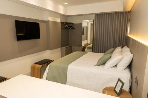 Ένα ή περισσότερα κρεβάτια σε δωμάτιο στο Riva Apart Hotel