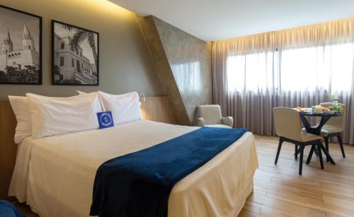 Cama ou camas em um quarto em Blue Tree Towers Rio Poty