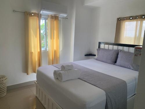 Postel nebo postele na pokoji v ubytování Plataview Apartahotel apt 4C