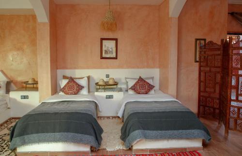 Una cama o camas en una habitación de Riad Gabsi Dades
