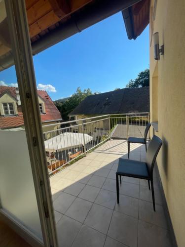 a view from the balcony of a house with a chair at Norling Guest House in Vienna