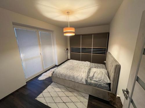 En eller flere senge i et værelse på Alicante Apartmen