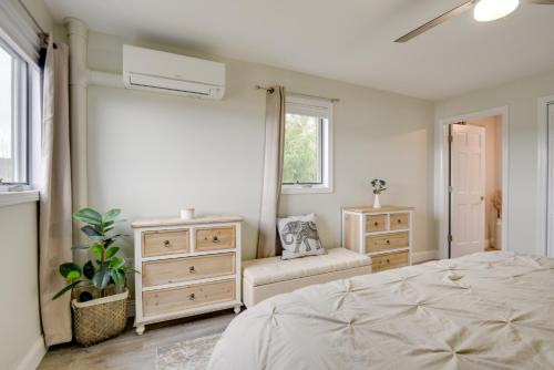 a bedroom with a bed and a dresser and a window at Newfound Lake Vacation Rental with Deck and Lake View in Bristol