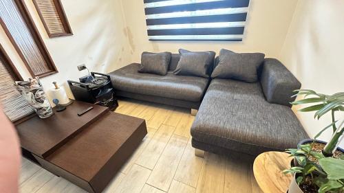 a living room with a couch and a coffee table at Room 78 in Coquimbo