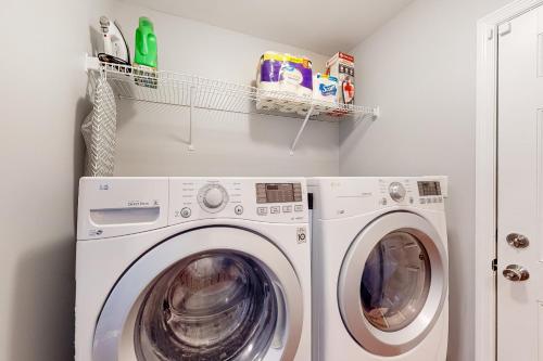 a laundry room with a washer and dryer at Swansboro Serenity in Swansboro