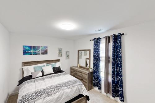Ένα ή περισσότερα κρεβάτια σε δωμάτιο στο Wildwood Comfort