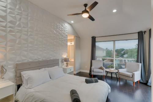 a bedroom with a bed and a large window at Prestigious 5BR 3,5BA Holiday Home with Pool, Sauna, Game Room & Bar in Sachse