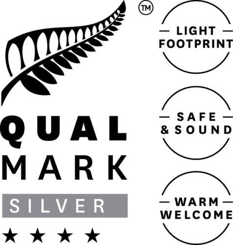 a set of four different fonts with a feather at Charming Spacious Rural Otaki Retreat in Otaki