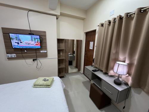 TV a/nebo společenská místnost v ubytování Darling Hotel Ciudad del Este