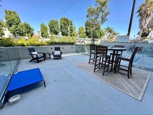 a patio with chairs and a table and chairs at Nimitz Crossing Luxury Residences in San Diego