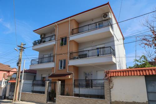 a building with balconies on the side of it at The Velvet Key Korce in Korçë