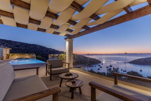 a living room with a view of the water at Blue Sea House in Agios Nikolaos