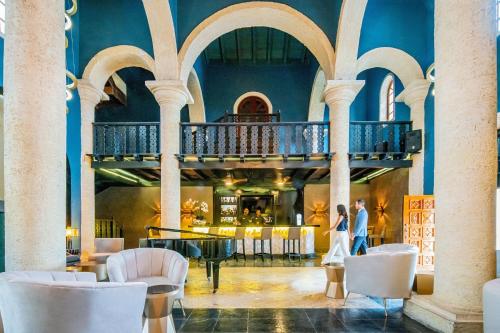 a bride and groom walking through the lobby of a building at Sanctuary Cap Cana, a Luxury Collection Resort, Dominican Republic, Adult All-Inclusive in Punta Cana