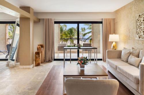 a living room with a couch and a table at Sanctuary Cap Cana, a Luxury Collection Resort, Dominican Republic, Adult All-Inclusive in Punta Cana