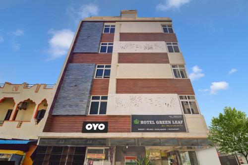 a tall building with a sign on it at Super Capital O Qualia Gachibowli in Hyderabad