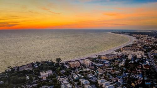 an aerial view of the beach at sunset at Newly remodeled 8-steps to sand path of Beach! Unit D in Siesta Key