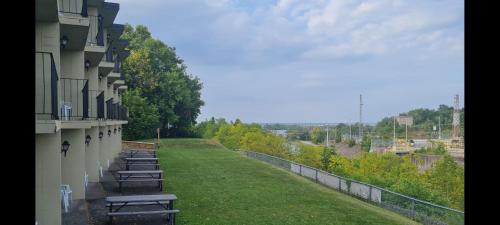a row of benches on the side of a building at The Inn At Lock Seven in Thorold
