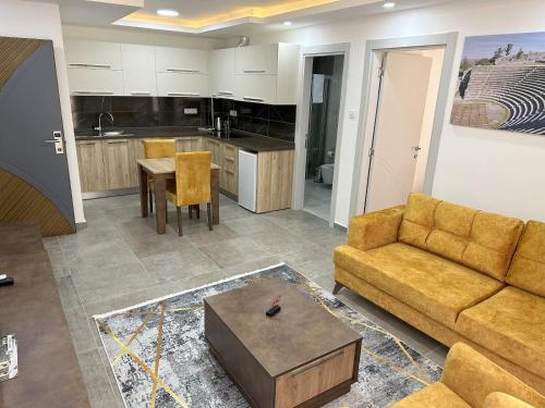 a living room with a couch and a table at Nurel Shark Residence in Kérynia