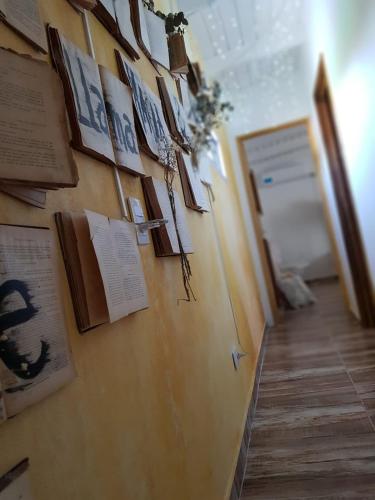a hallway with a wall with pictures on it at Magia in Roldán