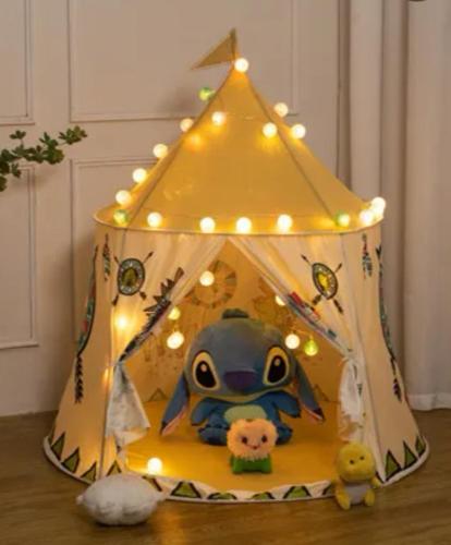 a toy house with lights on top of it at 宿の夜夜 広々一棟貸し駐車場2台 浴室2箇所 大家族グループ旅行に最適 静かな環境 in Omihachiman