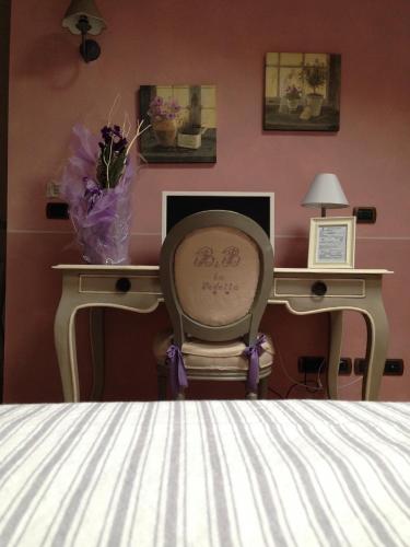 Ένα ή περισσότερα κρεβάτια σε δωμάτιο στο La Vedetta Bed and Breakfast