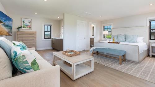 a bedroom with a bed and a living room at HOKU LANI HOUSE Heated Private Pool Spa Intro Pricing 25% off in Waimea