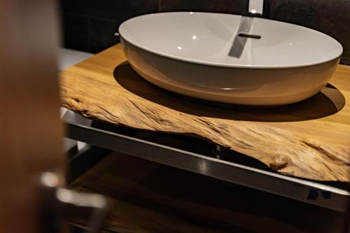 a bowl sink on a wooden counter in a bathroom at 全村的希望Hope of village in Dongshan