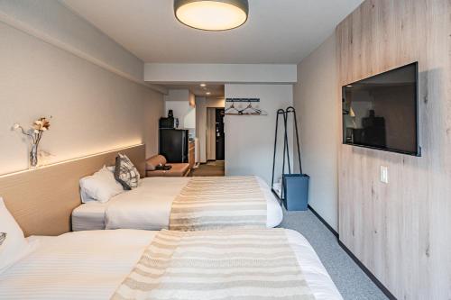 TV a/nebo společenská místnost v ubytování Apartment Hotel 11 Namba Minami 3