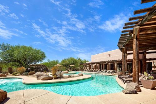 a pool at a resort with lounge chairs at Sheraton Grand at Wild Horse Pass in Chandler