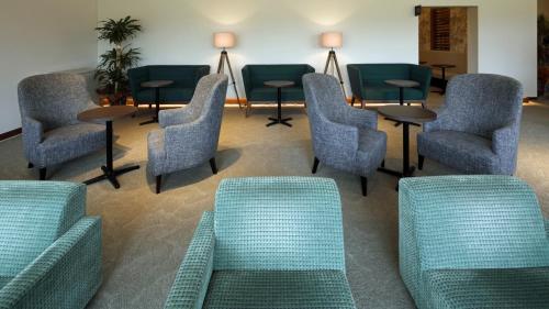 a waiting room with chairs and tables in a hospital at Kutsurogi no Yado Juraku - Vacation STAY 03506v in Tobe